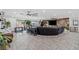 Spacious living room with tile floors and open concept feel to the kitchen area at 6995 Rogers St, Las Vegas, NV 89118