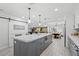 Open-concept living space features tile floors, modern décor, and a comfortable seating area at 6995 Rogers St, Las Vegas, NV 89118