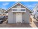 A small outbuilding featuring white siding and a white door, with a canopy over the entrance at 6995 Rogers St, Las Vegas, NV 89118
