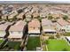 This aerial image highlights homes with green lawns and covered patios in a Gathering-friendly neighborhood at 7322 Dazzle Point St, North Las Vegas, NV 89084