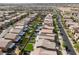 This aerial view presents homes with pools, shaded patios, and landscaped backyards in a vibrant community at 7322 Dazzle Point St, North Las Vegas, NV 89084