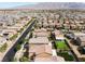 Expansive aerial view of a neighborhood featuring well-maintained homes and mountain views at 7322 Dazzle Point St, North Las Vegas, NV 89084
