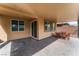 Back patio featuring a lounging area and view of the home's open sliding glass door at 7322 Dazzle Point St, North Las Vegas, NV 89084