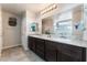 Dual sink bathroom with granite counters and ample storage; bright and modern at 7322 Dazzle Point St, North Las Vegas, NV 89084