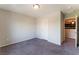 Bright empty bedroom with carpet flooring and access to the hallway and closet at 7322 Dazzle Point St, North Las Vegas, NV 89084