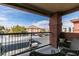 Balcony view of the apartment community, parking spots, and distant mountains at 8000 Badura Ave # 2063, Las Vegas, NV 89113