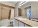 Well-lit bathroom featuring a vanity, mirror, and shower with tub at 8000 Badura Ave # 2063, Las Vegas, NV 89113