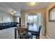 An open floor plan connects the dining room to the living room, with views to the balcony at 8000 Badura Ave # 2063, Las Vegas, NV 89113