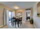 Inviting dining room with a view of outdoor space and bedroom; features a modern dining table at 8000 Badura Ave # 2063, Las Vegas, NV 89113