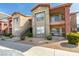 Well-maintained apartment building with stairs and manicured landscaping at 8000 Badura Ave # 2063, Las Vegas, NV 89113