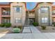 Well-maintained apartment building with stairs and manicured landscaping at 8000 Badura Ave # 2063, Las Vegas, NV 89113