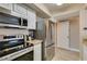 Updated kitchen with stainless steel appliances and modern cooking range at 8000 Badura Ave # 2063, Las Vegas, NV 89113