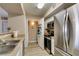 Bright kitchen featuring stainless steel refrigerator and modern appliances at 8000 Badura Ave # 2063, Las Vegas, NV 89113