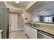 Bright kitchen with stainless steel dishwasher and sink under bar seating at 8000 Badura Ave # 2063, Las Vegas, NV 89113