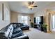 Comfortable living room with large sofa, ceiling fan, and lots of sunlight at 8000 Badura Ave # 2063, Las Vegas, NV 89113