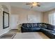 Bright living room with comfortable sofa, ceiling fan, and lots of sunlight at 8000 Badura Ave # 2063, Las Vegas, NV 89113