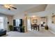 Cozy living room with a TV, dining table, and view into the bedroom at 8000 Badura Ave # 2063, Las Vegas, NV 89113