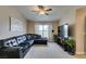 Comfortable living room with large sofa, ceiling fan, and lots of sunlight at 8000 Badura Ave # 2063, Las Vegas, NV 89113