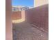 Backyard features low-maintenance gravel and privacy wall at 8089 Windmill Villa St, Las Vegas, NV 89139