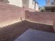 Enclosed backyard features a patio area and low-maintenance gravel landscaping at 8089 Windmill Villa St, Las Vegas, NV 89139