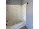 Bright bathroom features a white bathtub and shower with a tile surround at 8089 Windmill Villa St, Las Vegas, NV 89139