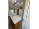 Bathroom with double sink vanity, large mirror, and good lighting at 8089 Windmill Villa St, Las Vegas, NV 89139