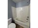 Bright bathroom features a white bathtub and shower with a tile surround at 8089 Windmill Villa St, Las Vegas, NV 89139