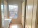 Bright bathroom with a vanity counter, tile flooring and two white storage cabinets at 8089 Windmill Villa St, Las Vegas, NV 89139
