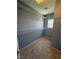 Spacious walk in closet featuring wire shelving and neutral carpet at 8089 Windmill Villa St, Las Vegas, NV 89139