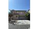Charming two-story home featuring a neutral color palette, spacious driveway, and mature landscaping at 8089 Windmill Villa St, Las Vegas, NV 89139