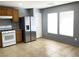 Well-lit kitchen featuring stainless steel refrigerator and tile flooring at 8089 Windmill Villa St, Las Vegas, NV 89139