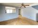 Inviting living room with wood floors and a ceiling fan offers a comfortable living space at 8089 Windmill Villa St, Las Vegas, NV 89139