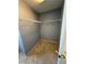 Carpeted walk-in closet includes wire shelving for efficient storage and organization at 8089 Windmill Villa St, Las Vegas, NV 89139