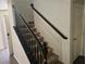 Carpeted stairs with black handrail lead upstairs, next to a closed white door, and the entry at 8226 Royal Lilly Ct, Las Vegas, NV 89139