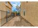 Backyard with a wrought-iron gate providing privacy and access at 8467 Bismark Sapphire St, Las Vegas, NV 89139