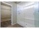 Bathroom with glass enclosed shower and walk-in closet with shelving at 8467 Bismark Sapphire St, Las Vegas, NV 89139