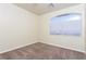 Inviting bedroom featuring neutral carpet and a window with bright natural light at 8467 Bismark Sapphire St, Las Vegas, NV 89139