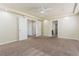 Spacious bedroom with neutral carpet, ceiling fan, recessed lighting, and multiple entryways at 8467 Bismark Sapphire St, Las Vegas, NV 89139