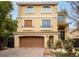 Charming two-story home with a two-car garage and beautifully landscaped front yard and brick driveway at 8467 Bismark Sapphire St, Las Vegas, NV 89139