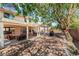 Large backyard with covered patio and mature trees at 9005 Feather River Ct, Las Vegas, NV 89117