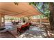 Spacious backyard featuring a covered patio with lounge seating at 9005 Feather River Ct, Las Vegas, NV 89117