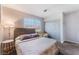 Cozy bedroom with large window and carpeted flooring at 9005 Feather River Ct, Las Vegas, NV 89117