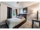 Comfortable bedroom with carpet, window, and a tufted headboard at 9005 Feather River Ct, Las Vegas, NV 89117