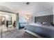 Comfortable bedroom with a large tufted headboard, futon, and plush carpet at 9005 Feather River Ct, Las Vegas, NV 89117
