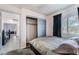 Bedroom featuring a sliding door closet and a street view at 9005 Feather River Ct, Las Vegas, NV 89117