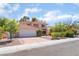 Charming two-story house with a well-maintained front yard, and tile roof at 9005 Feather River Ct, Las Vegas, NV 89117