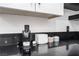Close up of a modern kitchen counter with new coffee maker and black countertops at 9005 Feather River Ct, Las Vegas, NV 89117