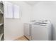 Bright laundry room with modern washer and dryer at 9005 Feather River Ct, Las Vegas, NV 89117