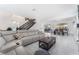 Spacious living room featuring a plush sectional sofa, and access to the dining area at 9005 Feather River Ct, Las Vegas, NV 89117