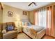 Cozy bedroom with an upholstered bed, soft lighting, and neutral decor at 950 Eagle Mountain Dr, Las Vegas, NV 89123